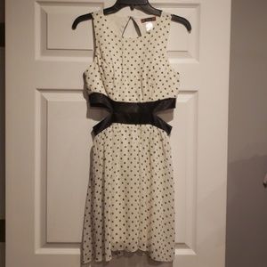 Polka dot dress side cutouts.